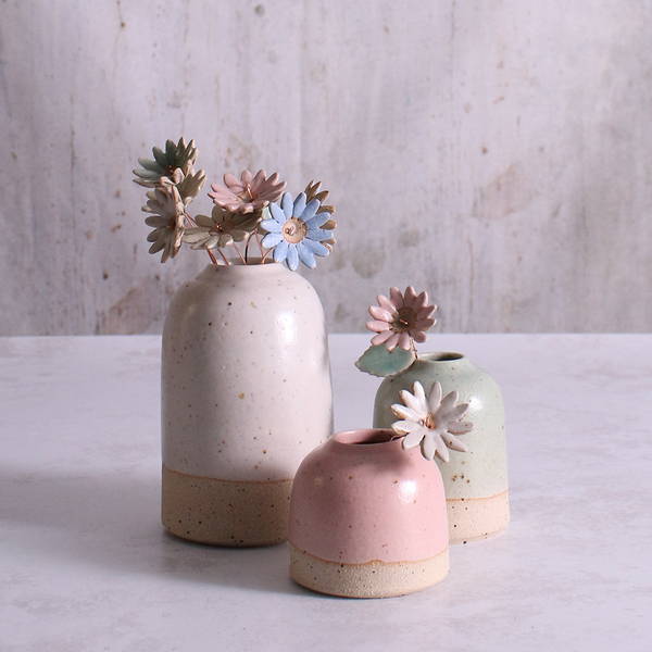 Handmade ceramic daisy flower stem in pastel vases. Each flower features a flexible copper wire stem for easy adjustment.