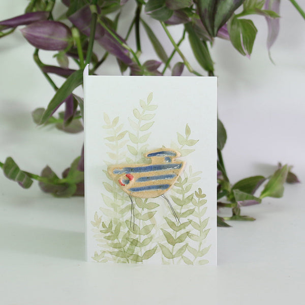 small ceramic and glass boat plant decoration, on gift card with watercolour leaves