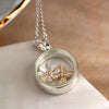 Silver Plated Circle Frame Necklace With Golden Bee And Daisy Charm